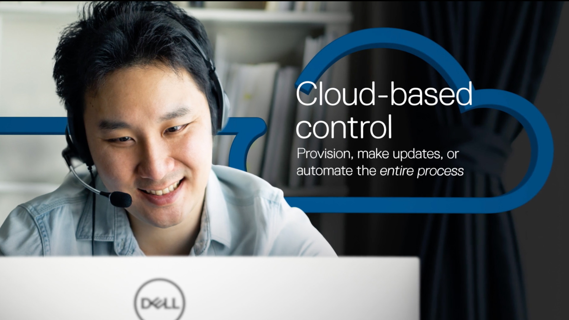 Image from the video series of a man with a headset looking at a Dell laptop screen with the text: Cloud-based control floating behind him.